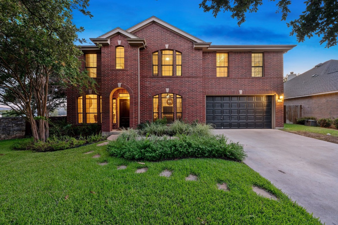 3520 Savoy Court Austin, TX 78738 - Photo 1 of 1 a front view of a house with garden
