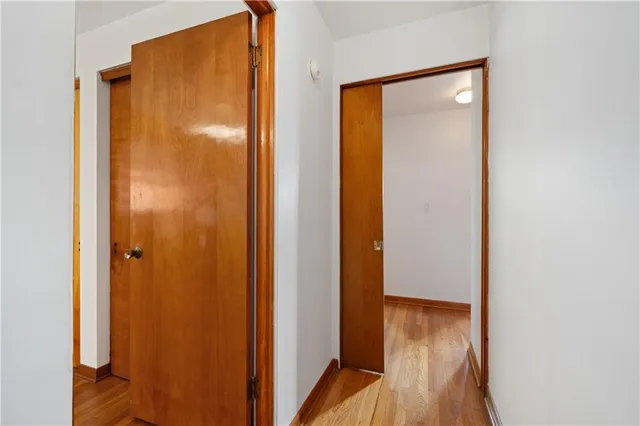 a bathroom with a glass door shower and a sink