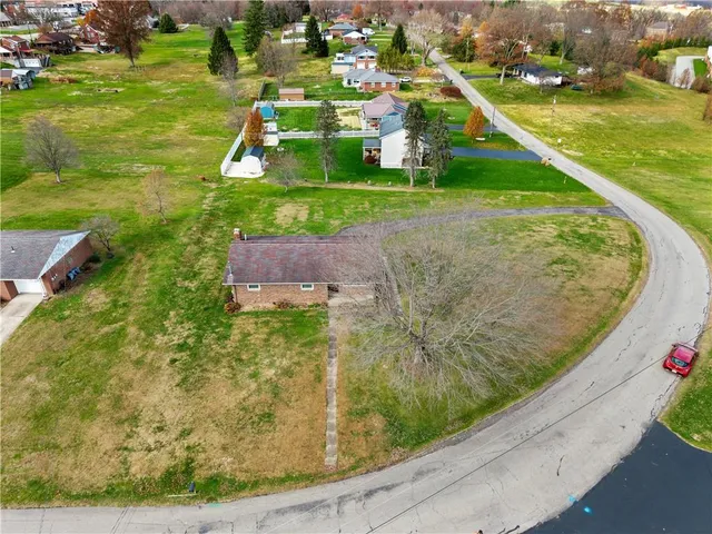 a small pool with some trees in the background