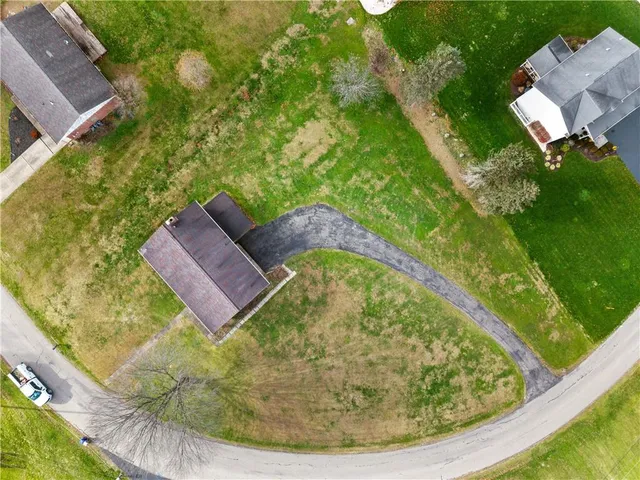 a view of a swimming pool with a yard