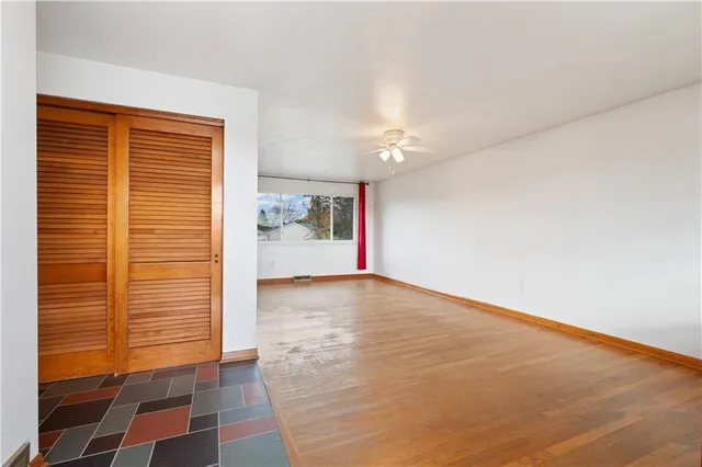 a view of an empty room with a window