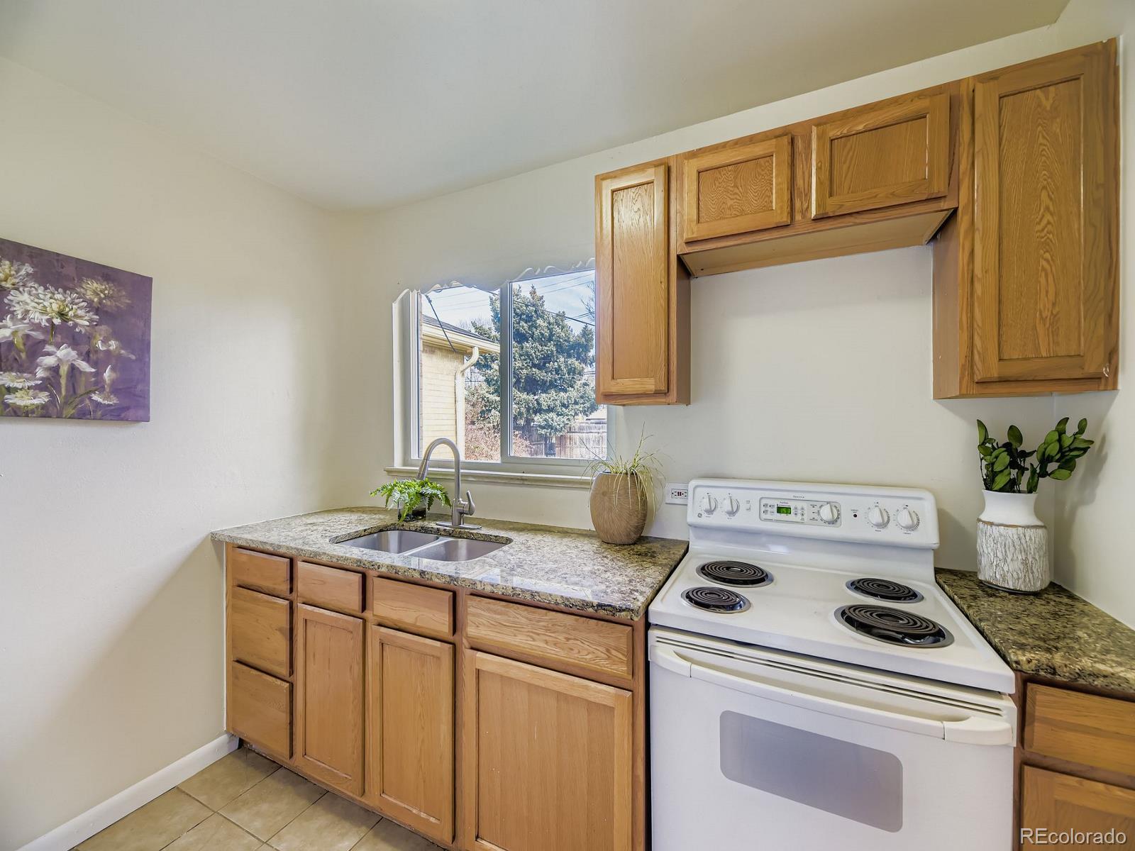 3820 Pierce Street Wheat Ridge, CO 80033 - Photo 13 of 32 a utility room with sink dryer and washer