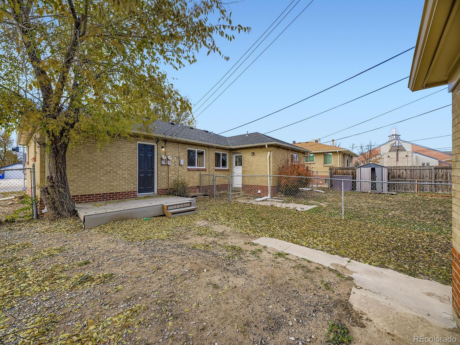 3820 Pierce Street Wheat Ridge, CO 80033 - Photo 25 of 32 a view of a house with a yard