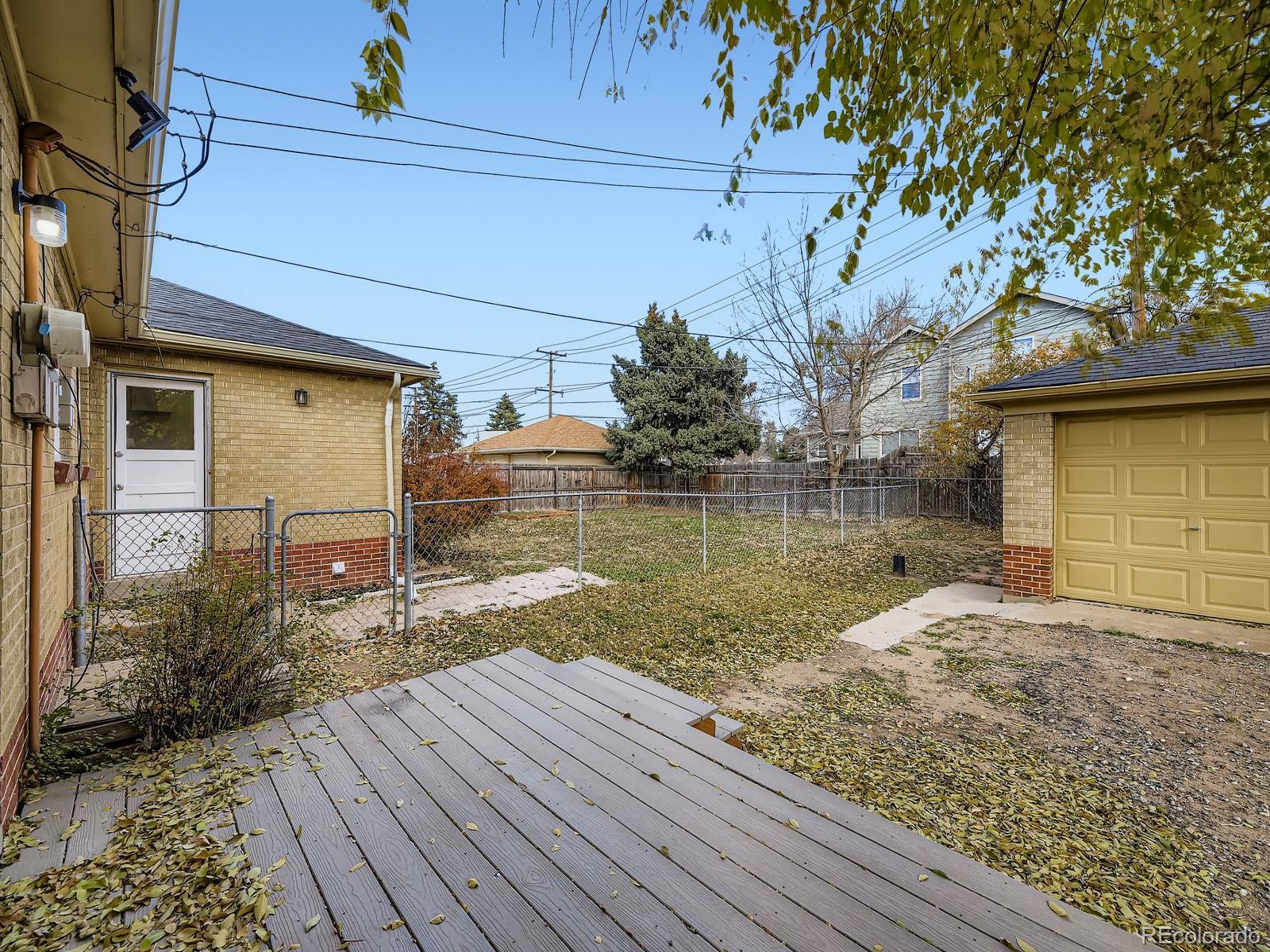 3820 Pierce Street Wheat Ridge, CO 80033 - Photo 27 of 32 a view of a backyard of the house