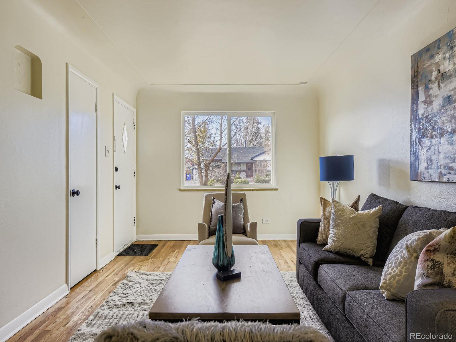3820 Pierce Street Wheat Ridge, CO 80033 - Photo 8 of 32 a living room with furniture and a window