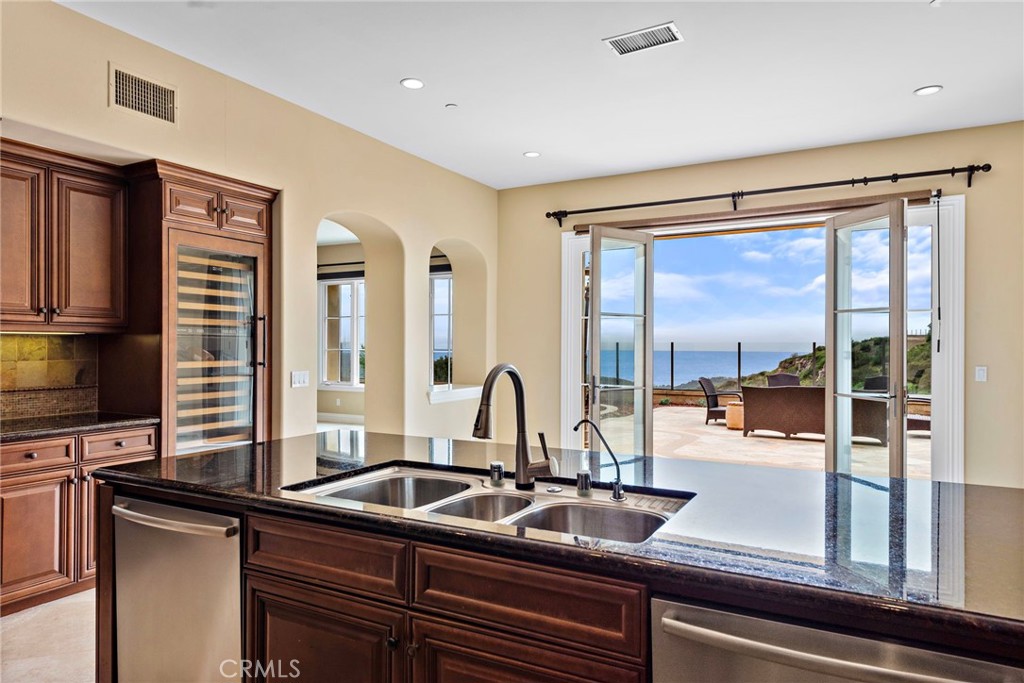 27 Pacific Mist Newport Coast, CA 92657 - Photo 11 of 44 a kitchen with granite countertop a sink and a window