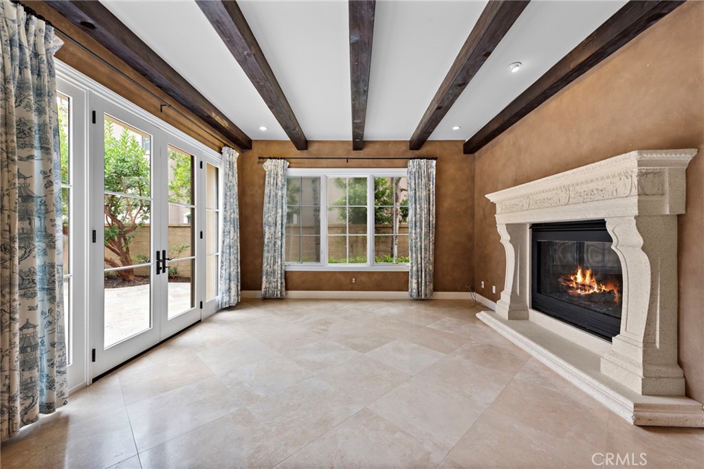 27 Pacific Mist Newport Coast, CA 92657 - Photo 15 of 44 a view of an empty room with windows and a fireplace