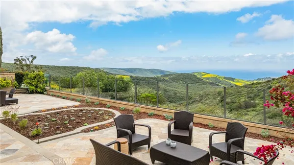 a view of a patio with furniture