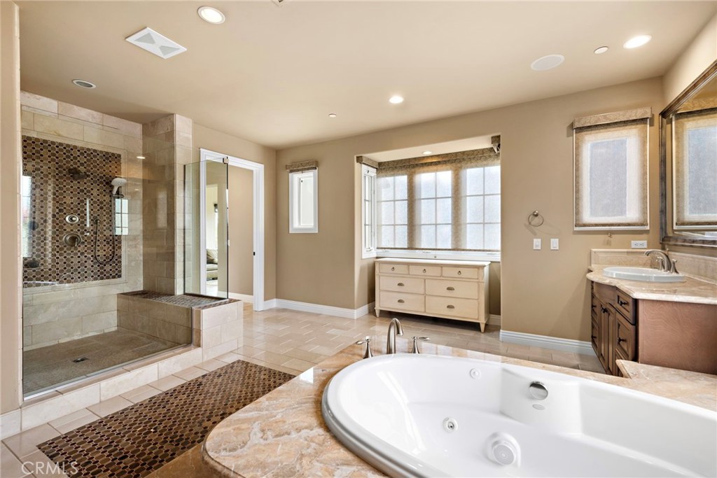 27 Pacific Mist Newport Coast, CA 92657 - Photo 30 of 44 a bathroom with a tub sink and mirror