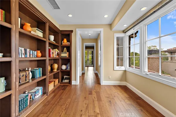 a view of an entryway with wooden floor