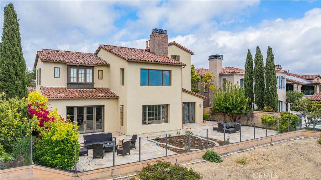 27 Pacific Mist Newport Coast, CA 92657 - Photo 41 of 44 a front view of a house with garden