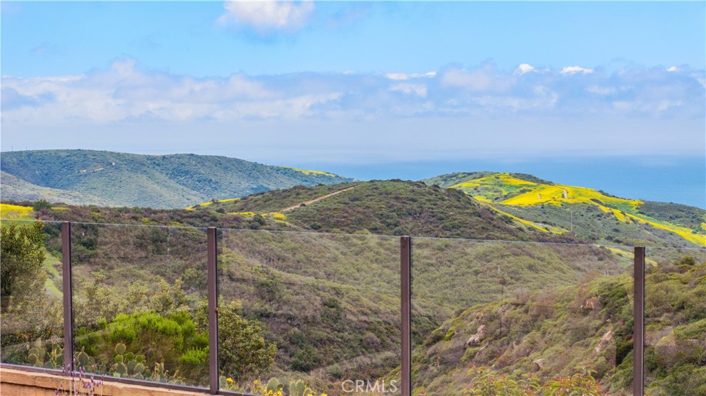 27 Pacific Mist Newport Coast, CA 92657 - Photo 44 of 44 a view of swimming pool and mountain in back
