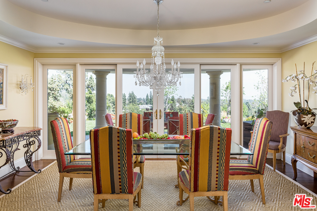 150 Patrician Way Pasadena, CA 91105 - Photo 11 of 43 a view of a dining room with furniture large windows and wooden floor