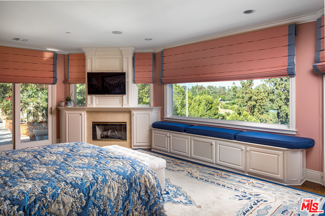 150 Patrician Way Pasadena, CA 91105 - Photo 27 of 43 a bed room with a bed and a television