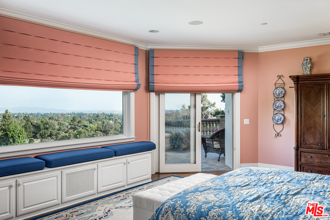 150 Patrician Way Pasadena, CA 91105 - Photo 28 of 43 a bedroom with a large window and a bed