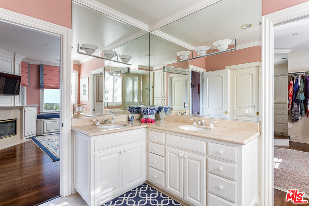 150 Patrician Way Pasadena, CA 91105 - Photo 31 of 43 a bathroom with a sink vanity granite and a mirror