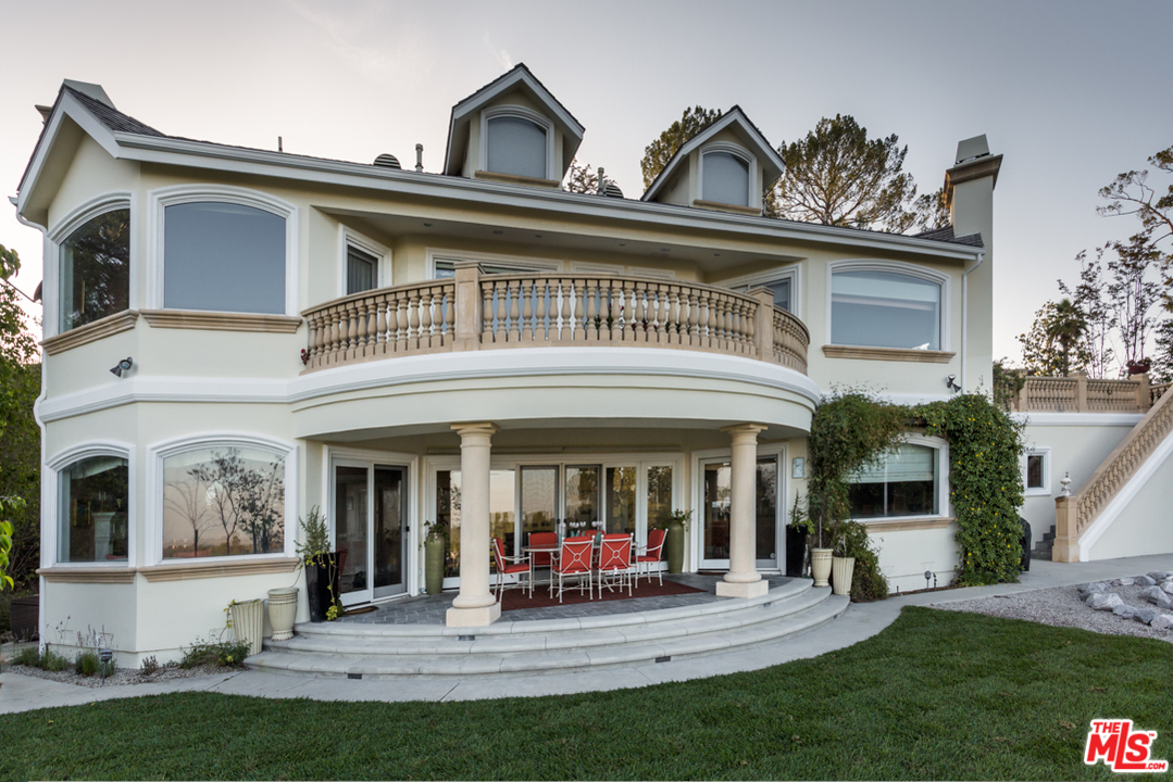 150 Patrician Way Pasadena, CA 91105 - Photo 39 of 43 a view of the house with a patio door and a table