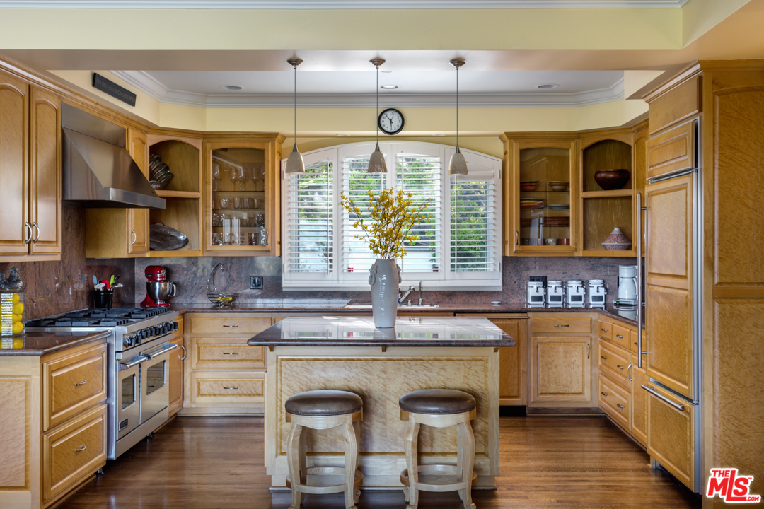 150 Patrician Way Pasadena, CA 91105 - Photo 9 of 43 a kitchen with stainless steel appliances granite countertop a sink and cabinets