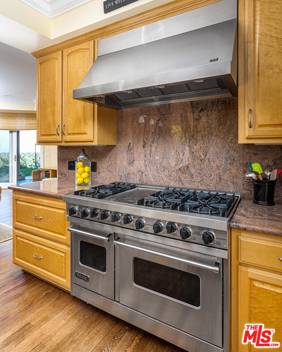 150 Patrician Way Pasadena, CA 91105 - Photo 10 of 43 a stove top oven sitting inside of a kitchen