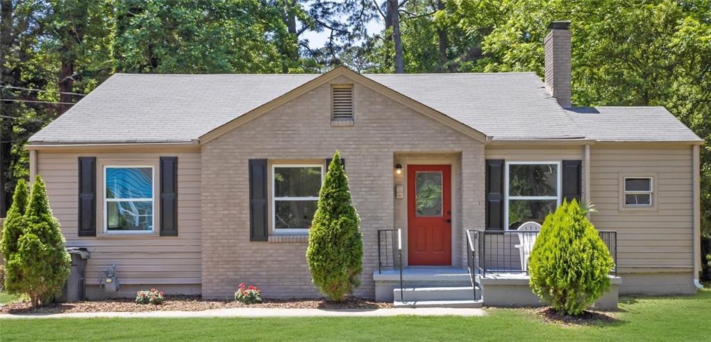 2115 Pinehurst Drive East Point, GA 30344 - Photo 1 of 1 a front view of a house with garden