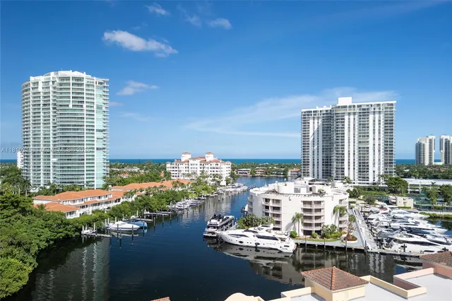 a kitchen with stainless steel appliances granite countertop a refrigerator and a stove
