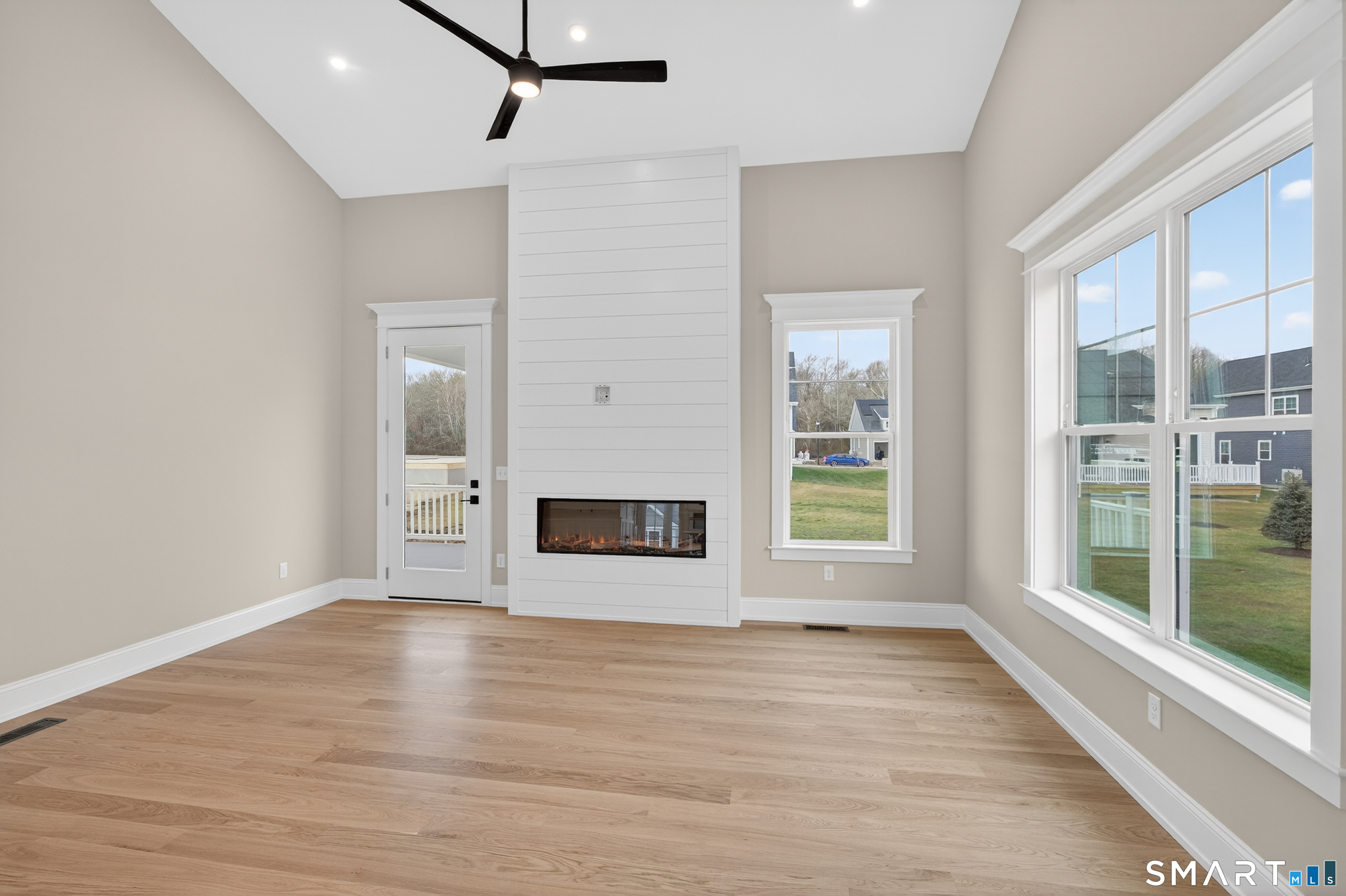 45 Summertime Circle Pawcatuck, CT 06379 - Photo 11 of 37 a view of empty room with wooden floor and fan