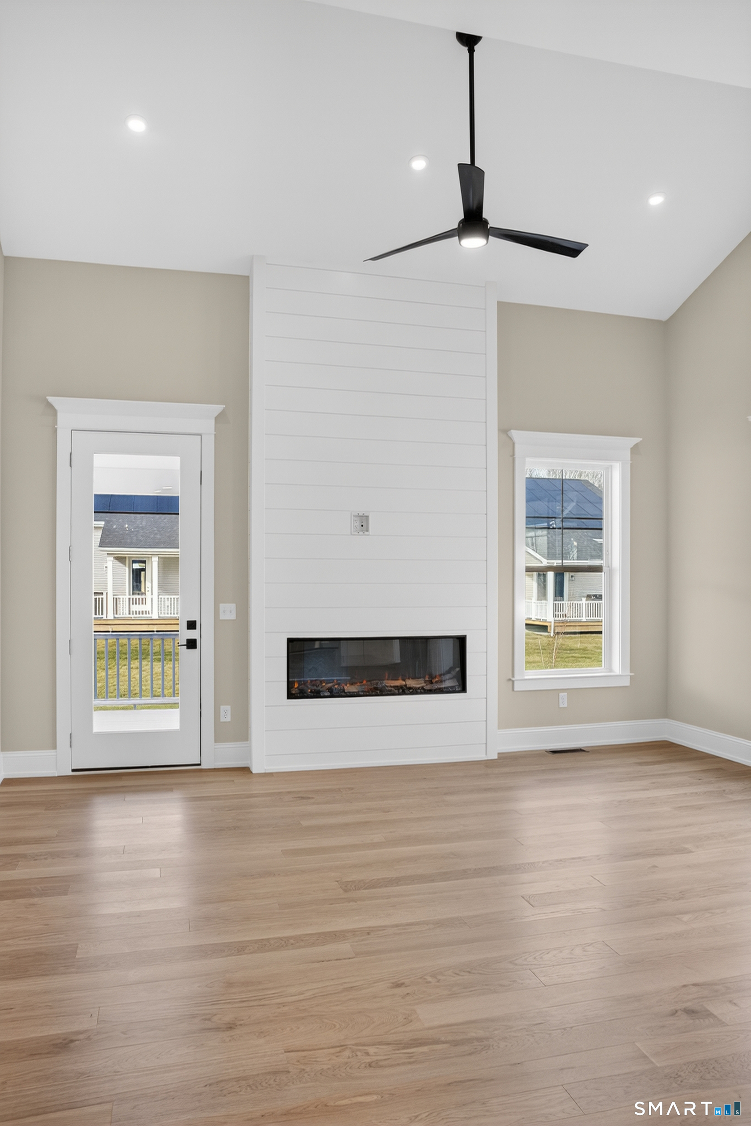 45 Summertime Circle Pawcatuck, CT 06379 - Photo 11 of 35 a view of an empty room with wooden floor and a window
