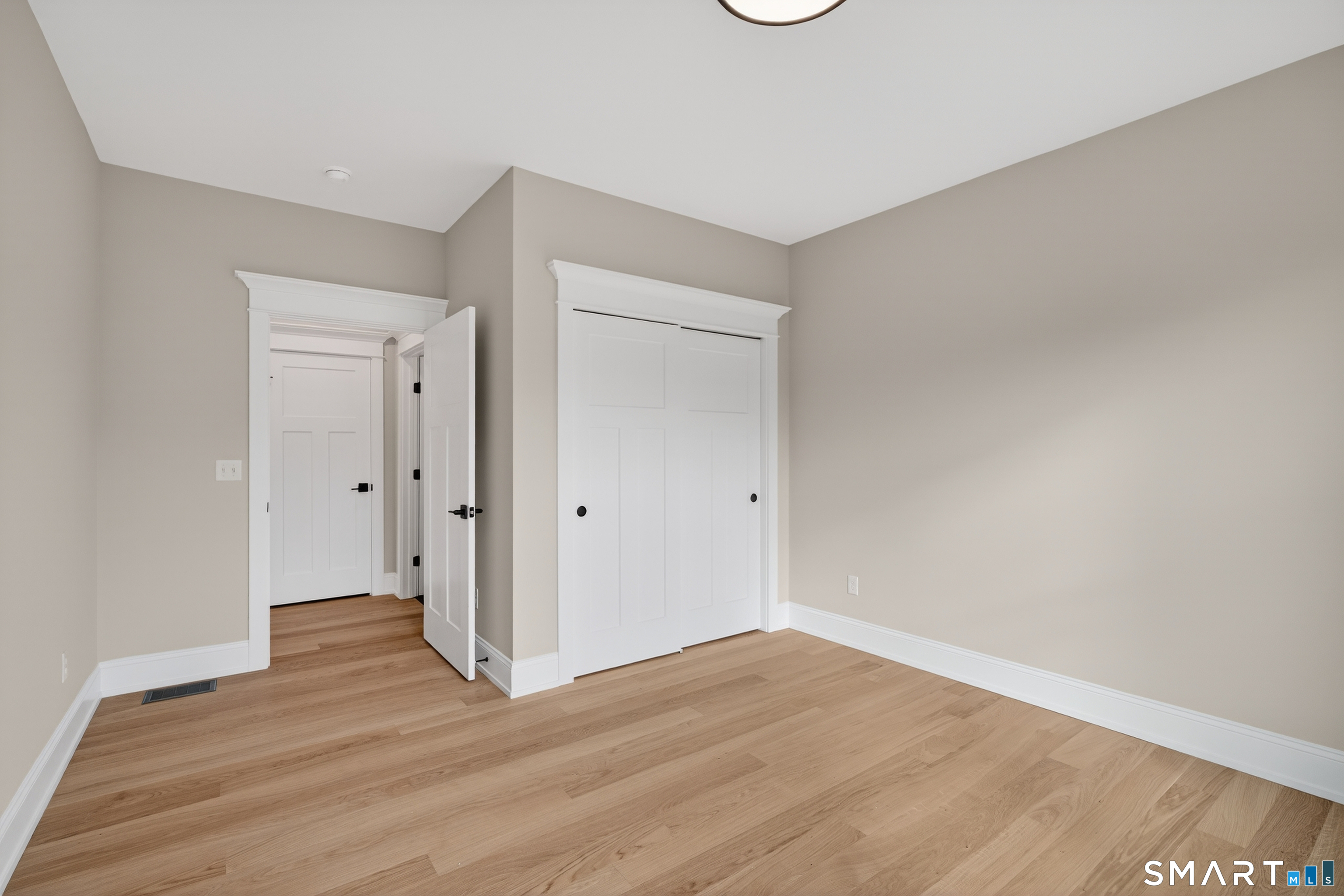 45 Summertime Circle Pawcatuck, CT 06379 - Photo 17 of 35 a view of an empty room and wooden floor