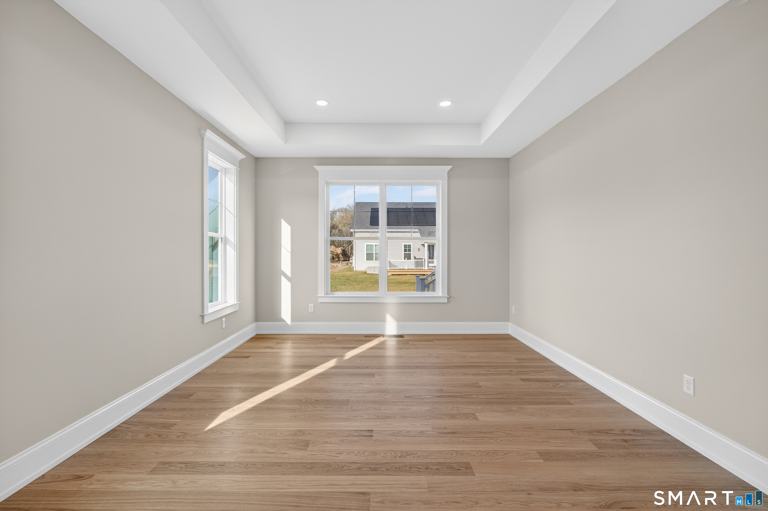 45 Summertime Circle Pawcatuck, CT 06379 - Photo 29 of 35 a view of an empty room with a window and wooden floor