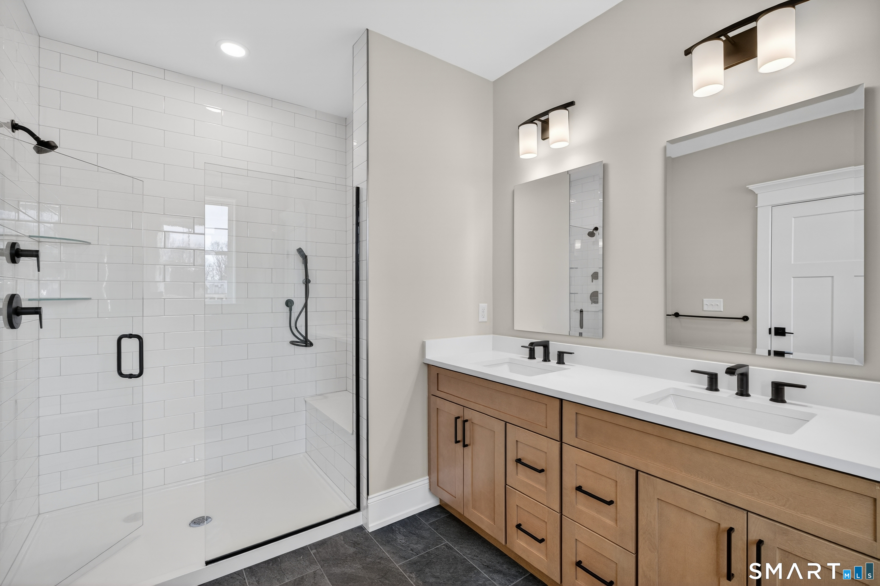 45 Summertime Circle Pawcatuck, CT 06379 - Photo 36 of 37 a bathroom with double sink and a mirror