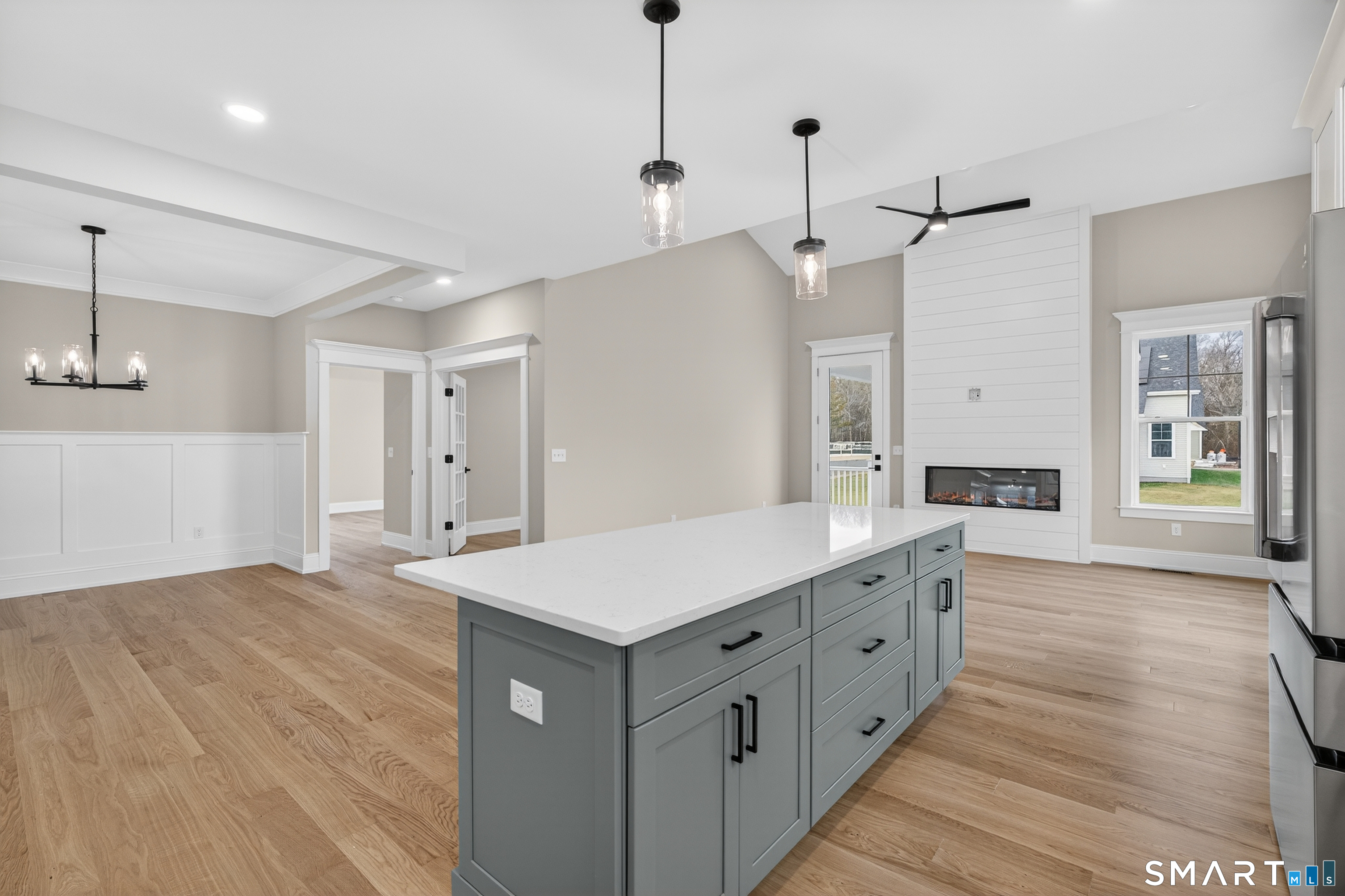 45 Summertime Circle Pawcatuck, CT 06379 - Photo 8 of 37 a large white kitchen with a sink a refrigerator and a stove