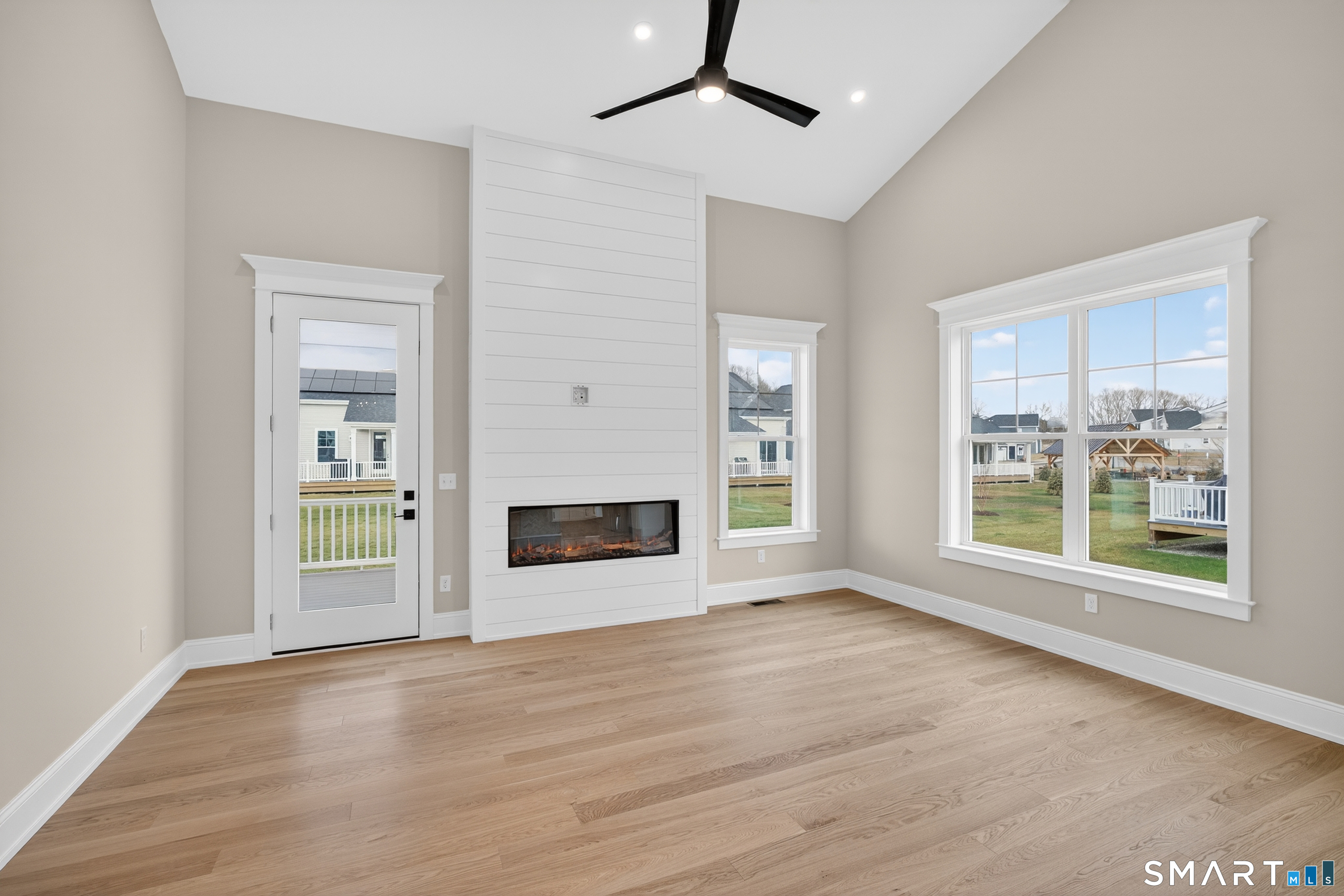 45 Summertime Circle Pawcatuck, CT 06379 - Photo 9 of 37 a view of an empty room with a window and wooden floor