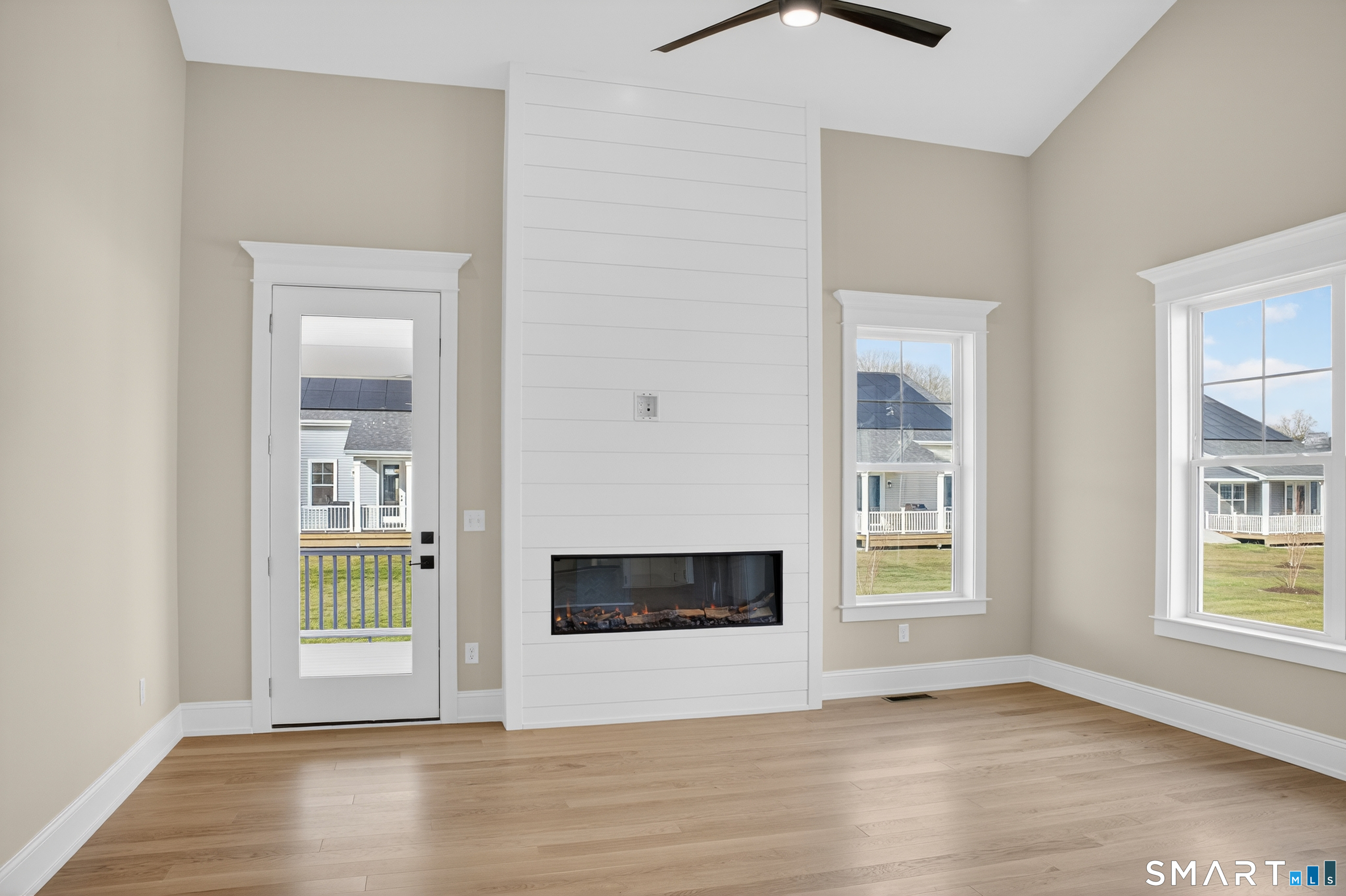 45 Summertime Circle Pawcatuck, CT 06379 - Photo 10 of 35 an empty room with wooden floor and windows
