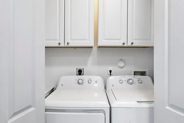 a utility room with dryer and washer