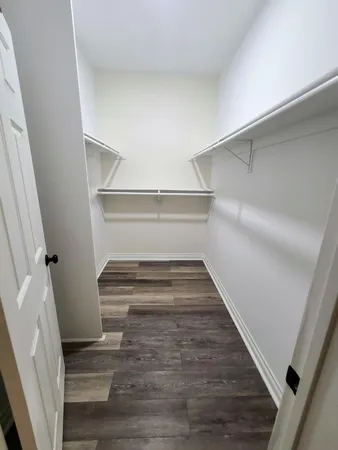 a kitchen with a refrigerator and a sink