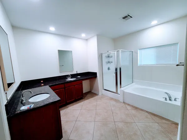 a white toilet sitting next to a shower