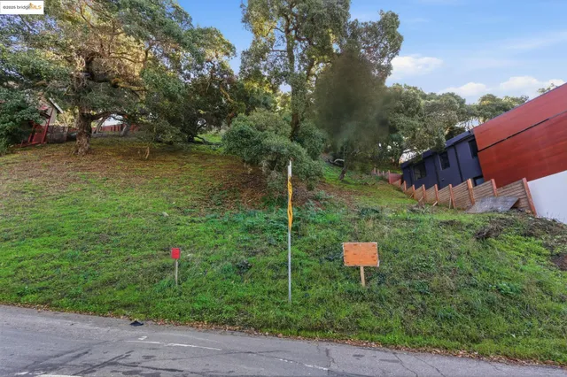 an aerial view of a house with a lake view