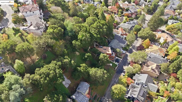 an aerial view of houses with yard