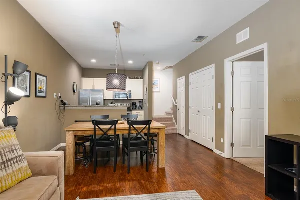 a view of a dining room with furniture window and wooden floor