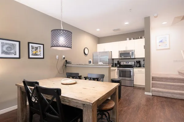 a kitchen with a table and chairs in it
