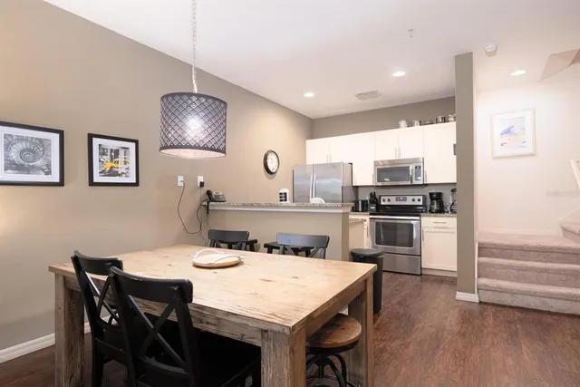 a kitchen with a table and chairs in it