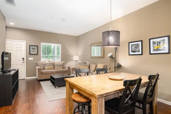 a view of a dining room with furniture and wooden floor