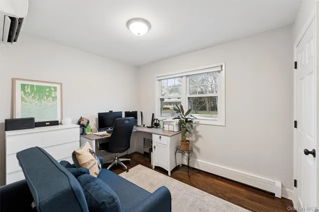 a work room with furniture and windows