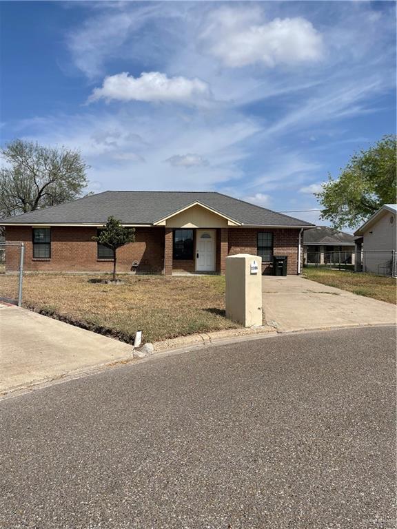 2306 Ocaso Road Mission, TX 78572 - Photo 2 of 12 a front view of a house with a yard and garage