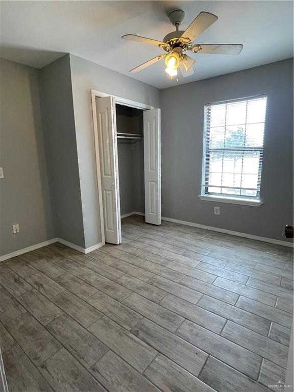 2306 Ocaso Road Mission, TX 78572 - Photo 5 of 12 wooden floor in an empty room with a window