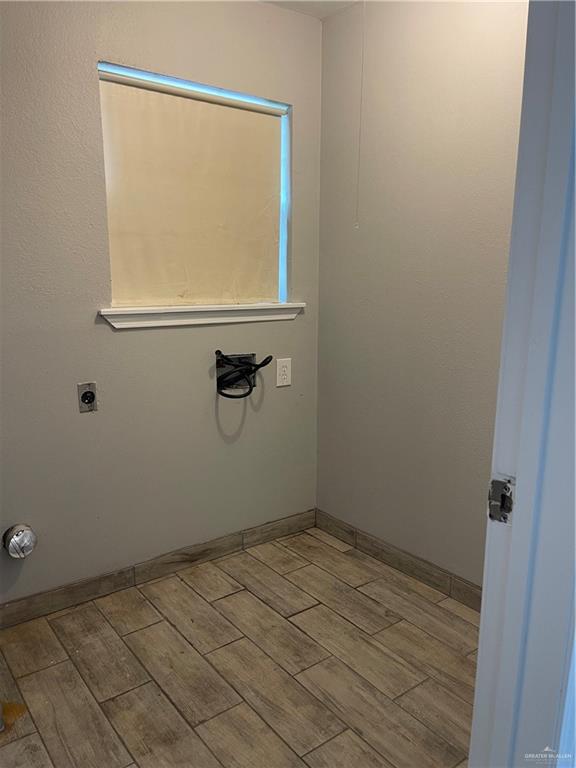2306 Ocaso Road Mission, TX 78572 - Photo 9 of 12 wooden floor in a bathroom next to a shower