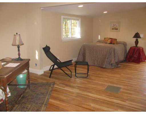 10 Kardon Road Boston, MA 02136 - Photo 9 of 16 a bedroom with furniture and a wooden floor