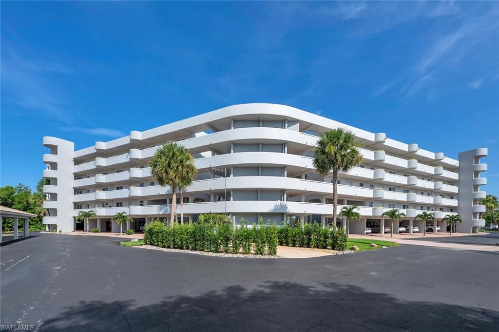 12945 Vanderbilt Drive, Unit 304 Naples, FL 34110 - Photo 2 of 45 a front view of a building