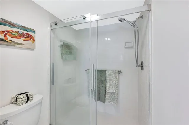 a bathroom with a shower and a sink