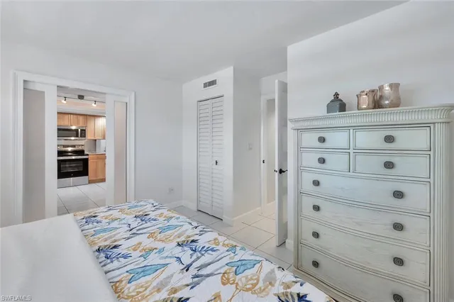 a bedroom with a bed and a dresser